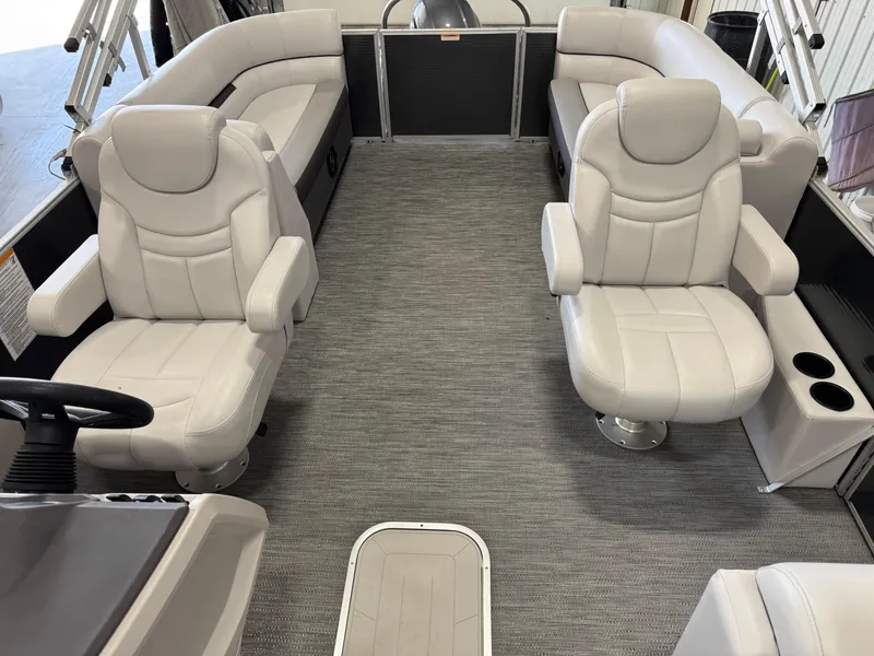 Slide: The Image of Interior of 2023 Sweetwater 2286 pontoon boat with plush seating and modern design. - 7