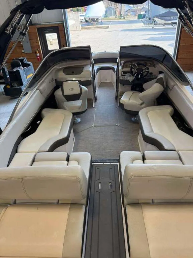 Slide: The Image of 2014 Regal 2300 boat interior with spacious seating and modern design. - 6
