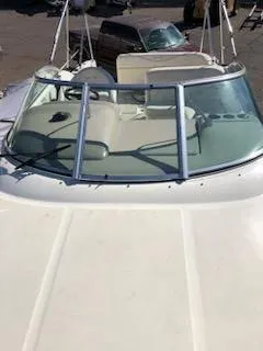 Slide: The Image of 2001 Sea Ray 260DA boat with windshield and cockpit view. - 10