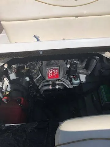 Slide: The Image of Engine compartment of a 2001 Sea Ray 260DA boat, featuring a 6.2L engine. - 16