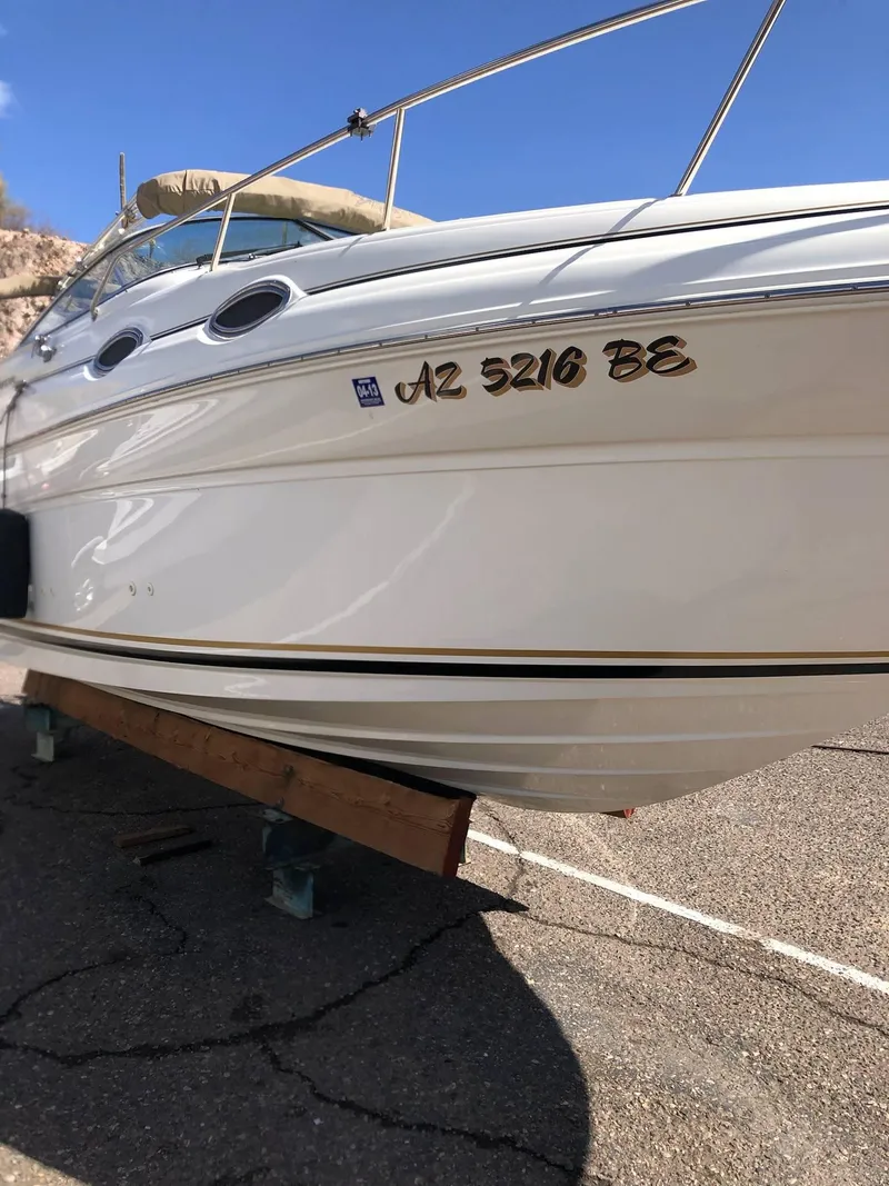Slide: The Image of 2001 Sea Ray 260DA boat on dry dock, displaying registration number AZ 5216 BE. - 3