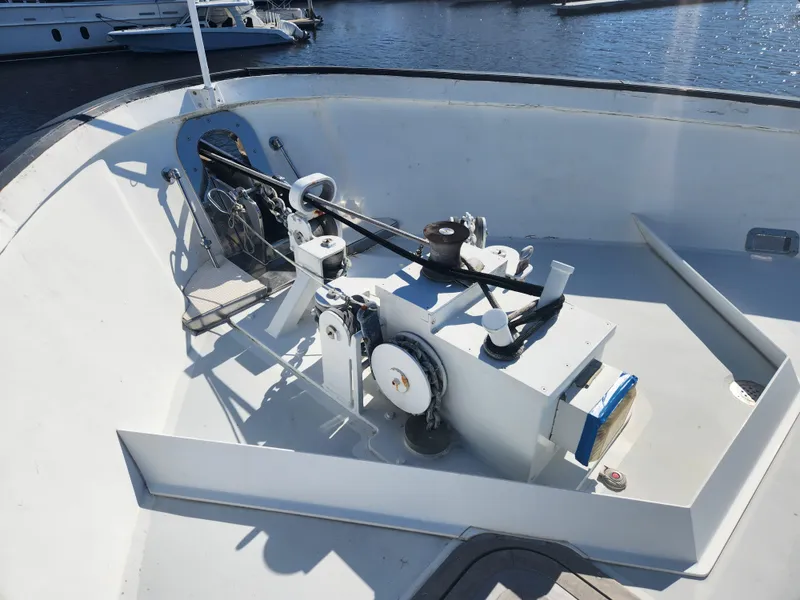 Slide: The Image of Anchor winch on 1983 Custom 76 Trawler, docked at marina. - 26