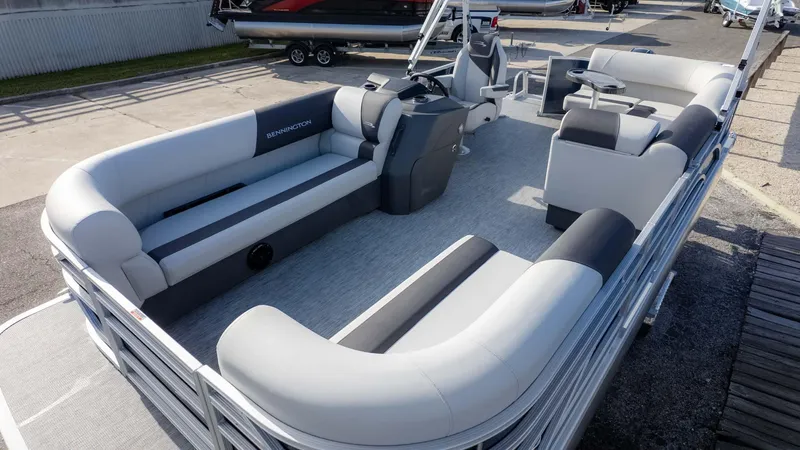 Slide: The Image of 2025 Bennington 20 SL pontoon boat with spacious seating and modern design. - 12