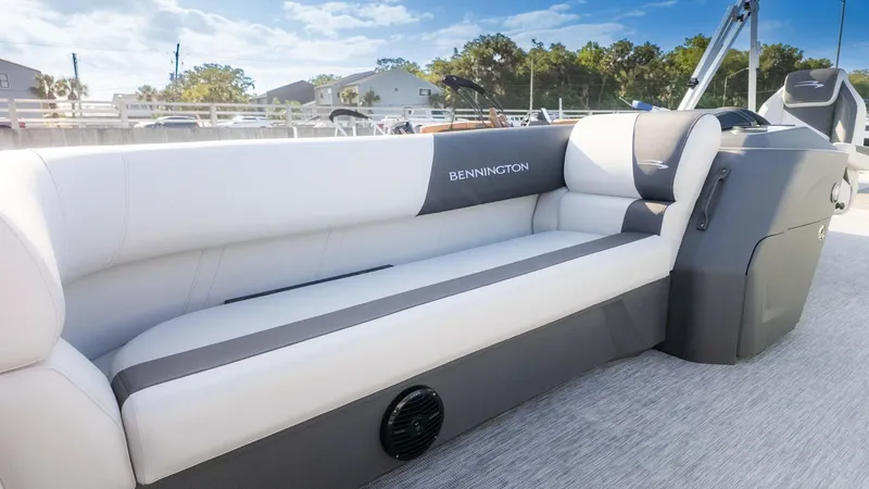 Slide: The Image of 2025 Bennington 20 SL boat interior with sleek, modern seating design. - 13