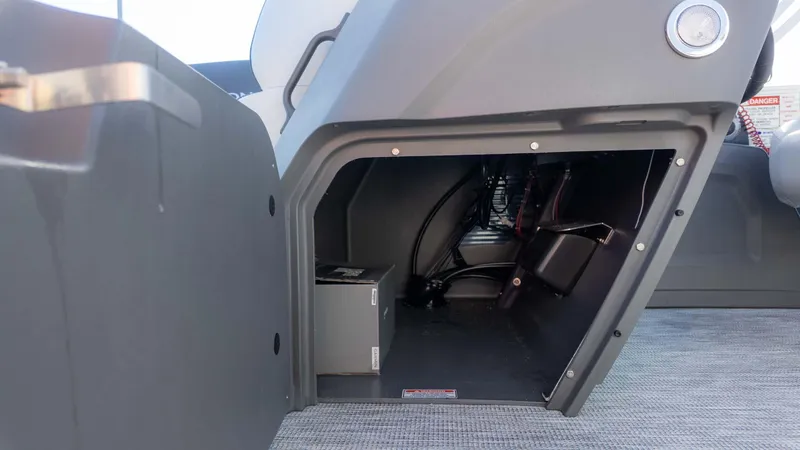 Slide: The Image of Storage compartment of 2025 Bennington 20 SL boat, showcasing interior space and wiring. - 15
