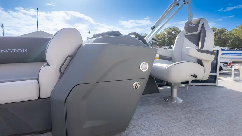 Slide: The Image of 2025 Bennington 20 SL boat interior with modern seating and control panel. - 16