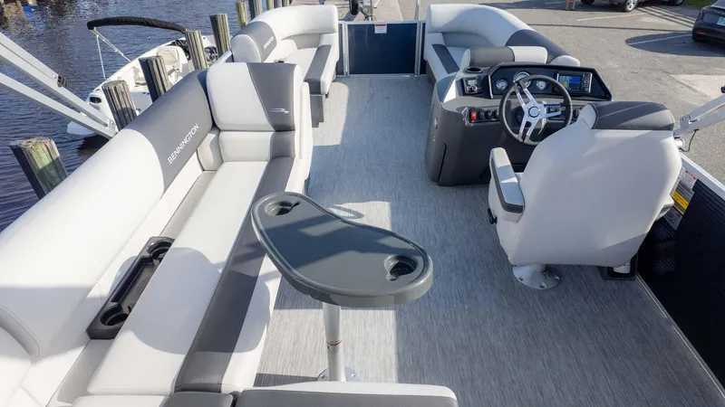 Slide: The Image of 2025 Bennington 20 SL pontoon boat interior with seating and steering console. - 6