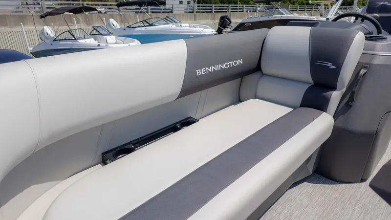 Slide: The Image of 2025 Bennington 20SSRSE boat interior with sleek, modern seating design. - 13