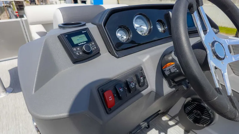 Slide: The Image of 2025 Bennington 20SSRSE boat dashboard with steering wheel and control panel. - 18