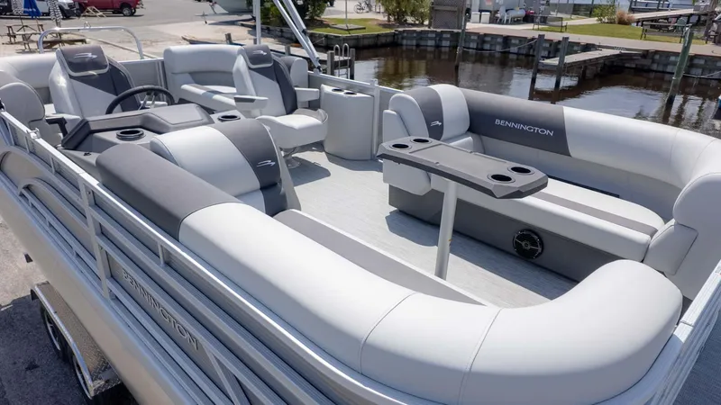 Slide: The Image of 2025 Bennington 20SSRSE pontoon boat with spacious seating and modern design. - 3