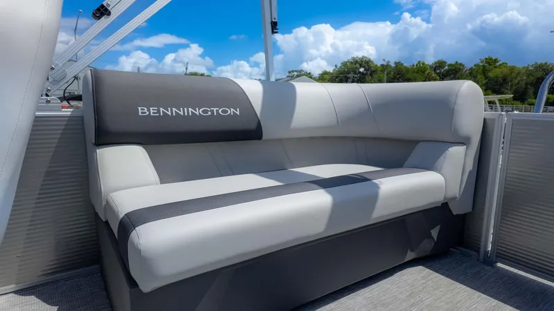 Slide: The Image of 2025 Bennington 20SSRSE boat seat with gray upholstery under a blue sky. - 6