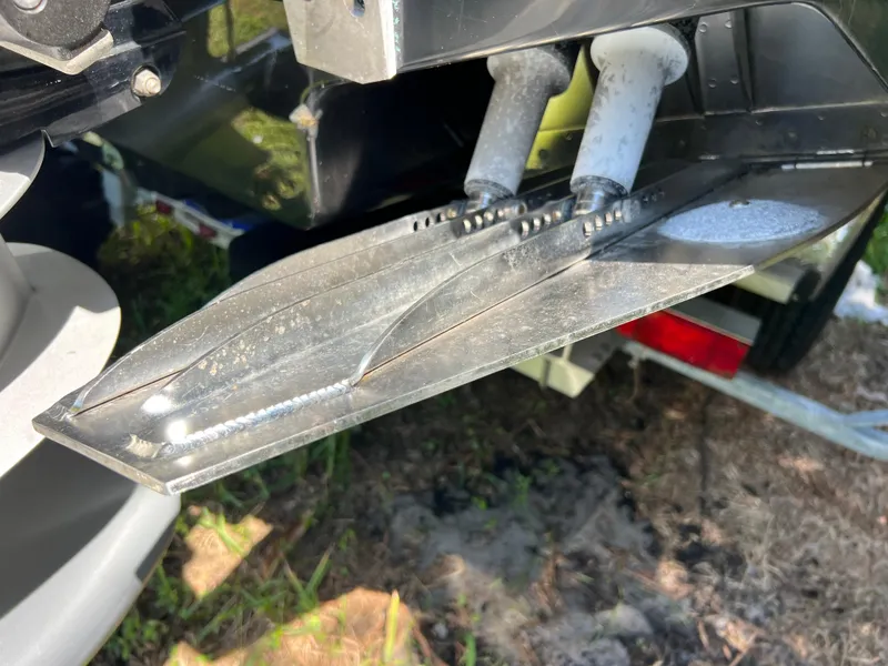 Slide: The Image of Trim tabs on a 2012 Hydra-Sports 3400 CC boat, close-up view. - 12