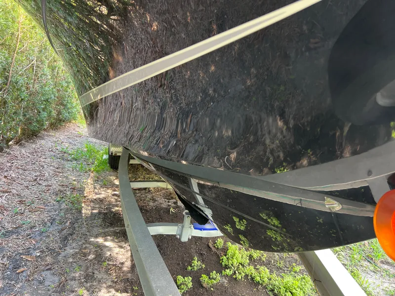 Slide: The Image of 2012 Hydra-Sports 3400 CC boat on trailer, side view with greenery. - 15