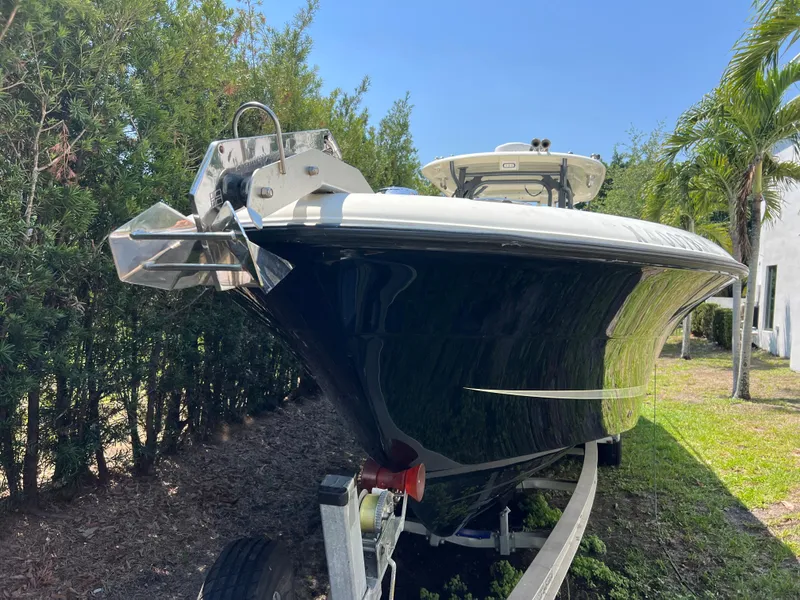 Slide: The Image of 2012 Hydra-Sports 3400 CC boat on trailer, parked outdoors near trees. - 17