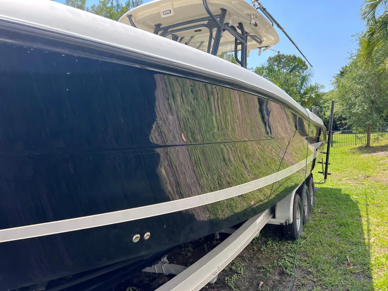 Slide: The Image of 2012 Hydra-Sports 3400 CC boat on trailer, side view, outdoors. - 19