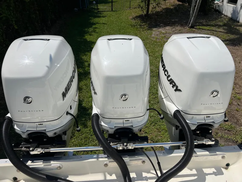 Slide: The Image of Triple Mercury outboard engines on a 2012 Hydra-Sports 3400 CC boat. - 21