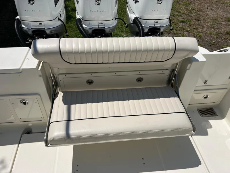 Slide: The Image of 2012 Hydra-Sports 3400 CC boat with foldable bench seat and triple outboard motors. - 22
