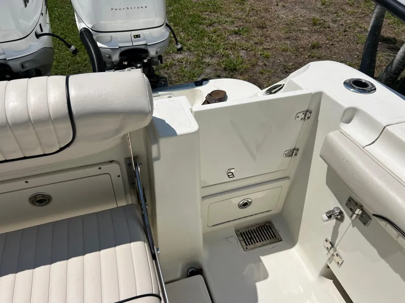 Slide: The Image of 2012 Hydra-Sports 3400 CC boat interior with seating and storage compartments. - 23