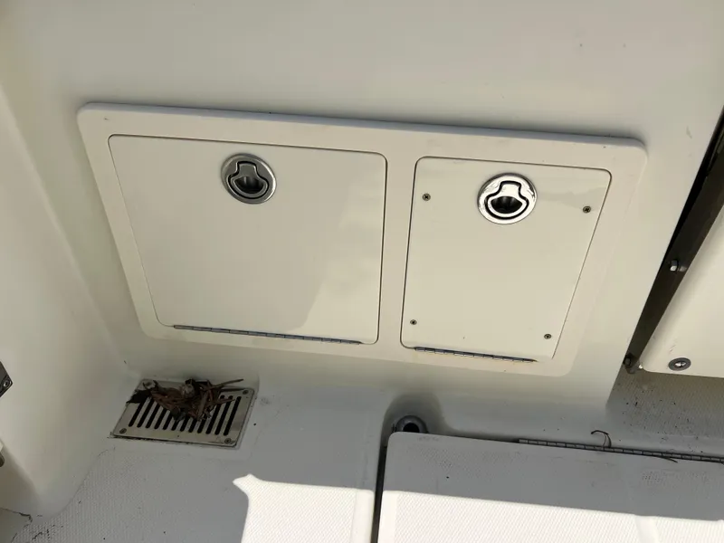 Slide: The Image of 2012 Hydra-Sports 3400 CC boat storage compartments and deck detail. - 25