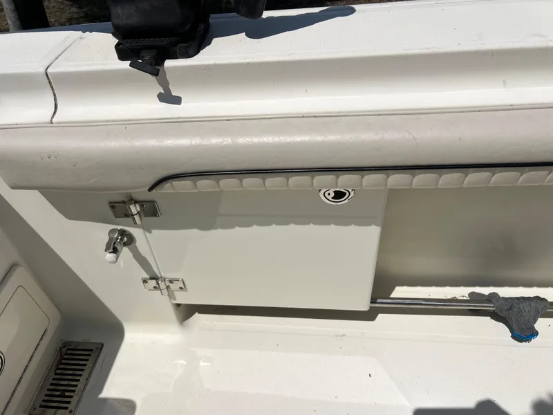 Slide: The Image of 2012 Hydra-Sports 3400 CC boat interior detail with storage compartment and latch. - 26