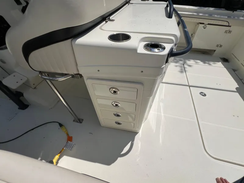 Slide: The Image of 2012 Hydra-Sports 3400 CC boat interior with storage drawers and seating. - 28