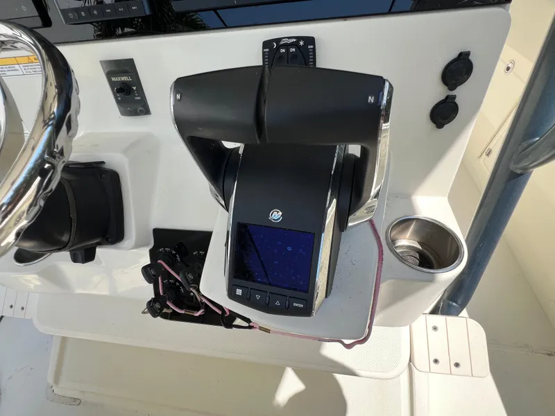 Slide: The Image of 2012 Hydra-Sports 3400 CC boat control panel with throttle and cup holder. - 31