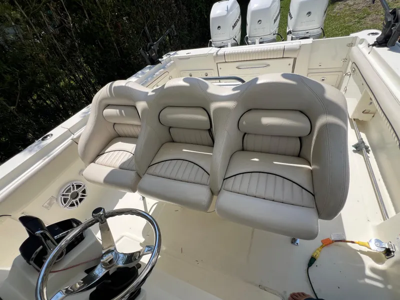 Slide: The Image of 2012 Hydra-Sports 3400 CC boat interior with three cushioned seats and steering wheel. - 39