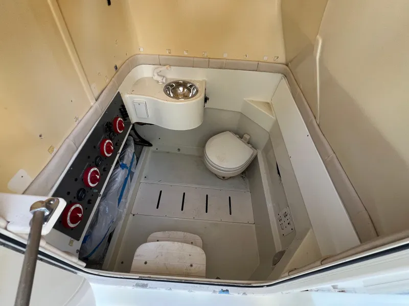 Slide: The Image of 2012 Hydra-Sports 3400 CC boat interior with toilet and sink. - 42