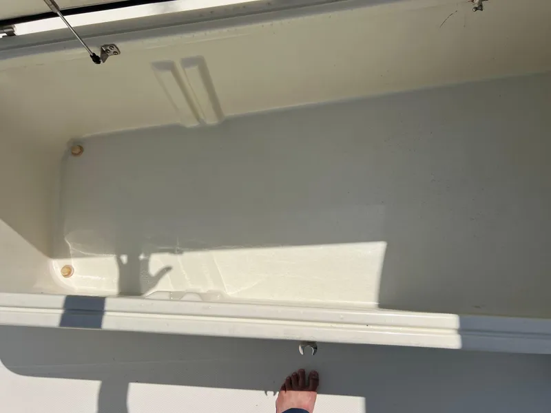 Slide: The Image of 2012 Hydra-Sports 3400 CC boat storage compartment, open and empty. - 49
