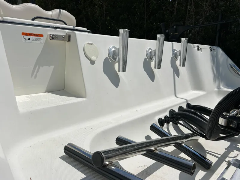 Slide: The Image of 2012 Hydra-Sports 3400 CC boat deck with rod holders and stainless steel fittings. - 6