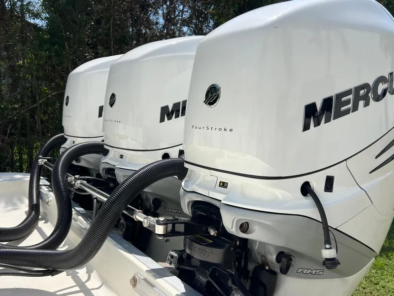 Slide: The Image of Triple Mercury outboard engines on a 2012 Hydra-Sports 3400 CC boat. - 7