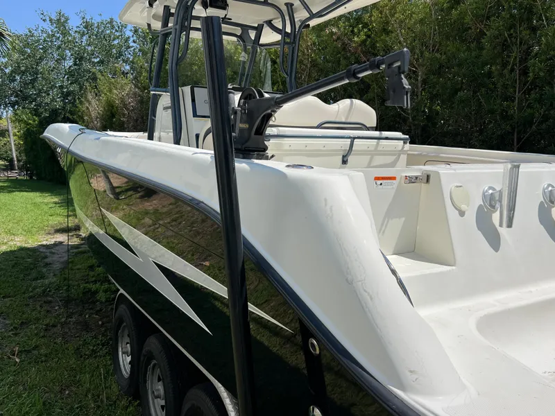Slide: The Image of 2012 Hydra-Sports 3400 CC boat on trailer, parked on grass, side view. - 9