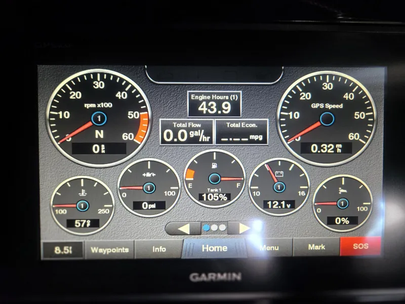 Slide: The Image of Dashboard display of a 2019 Cobalt 25SC boat with various gauges and metrics. - 14