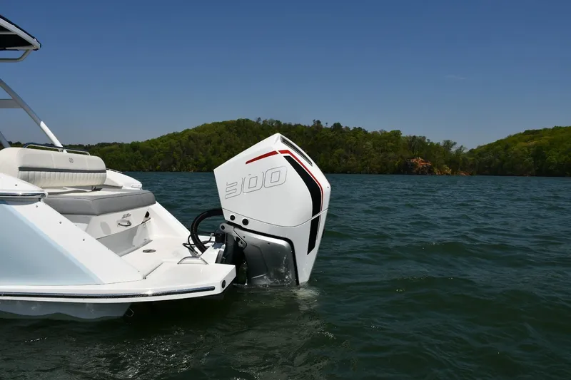 Slide: The Image of 2019 Cobalt 25SC boat with powerful outboard motor on a serene lake. - 6