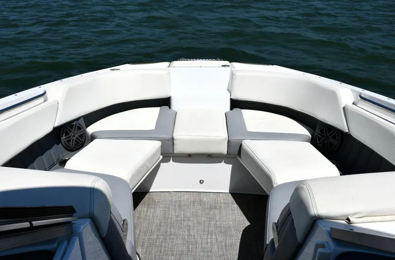 Slide: The Image of Bow seating area of 2019 Cobalt 25SC boat on water. - 7