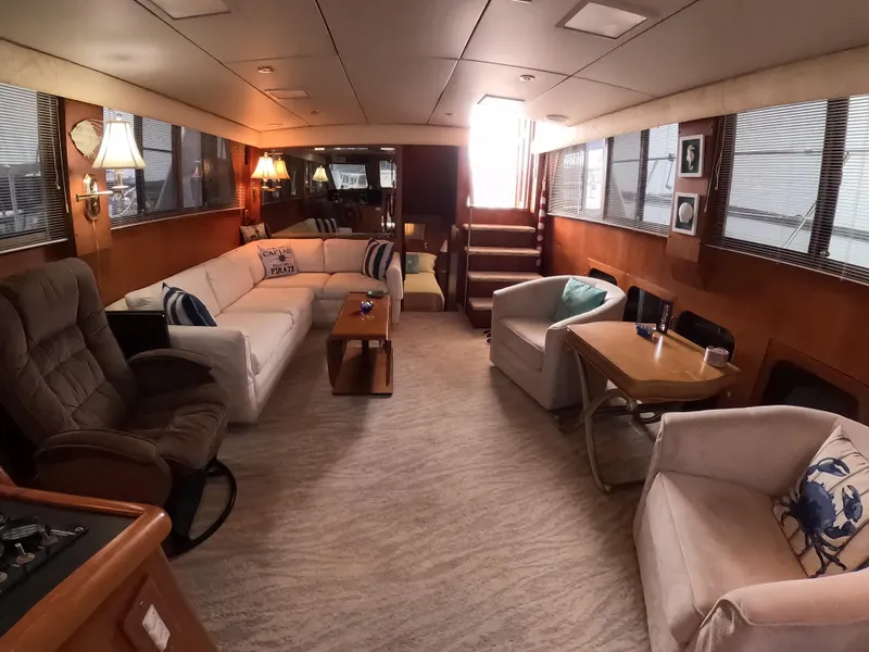 Slide: The Image of Luxurious interior of a 1995 Jefferson 48 Rivanna yacht with comfortable seating and elegant decor. - 11
