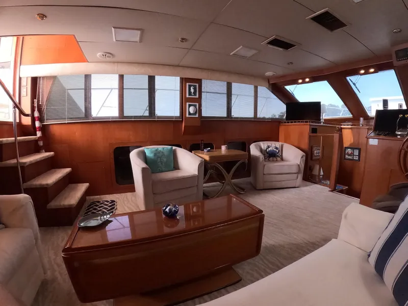 Slide: The Image of Luxurious interior of a 1995 Jefferson 48 Rivanna yacht with elegant seating and decor. - 13