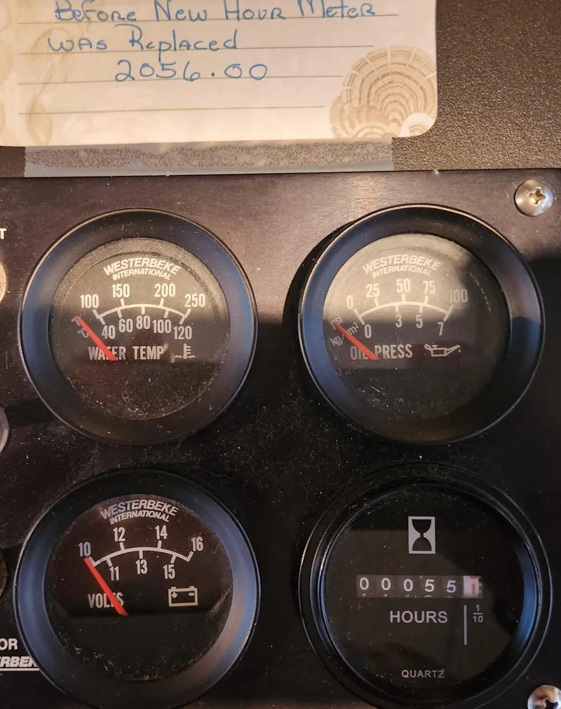 Slide: The Image of 1995 Jefferson 48 Rivanna dashboard with gauges for water temp, oil pressure, volts, and hours. - 38