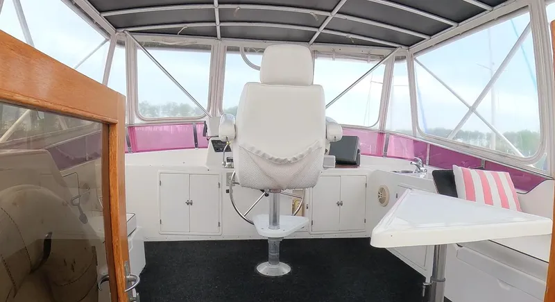 Slide: The Image of Interior of 1995 Jefferson 48 Rivanna yacht with captain's chair and panoramic windows. - 7