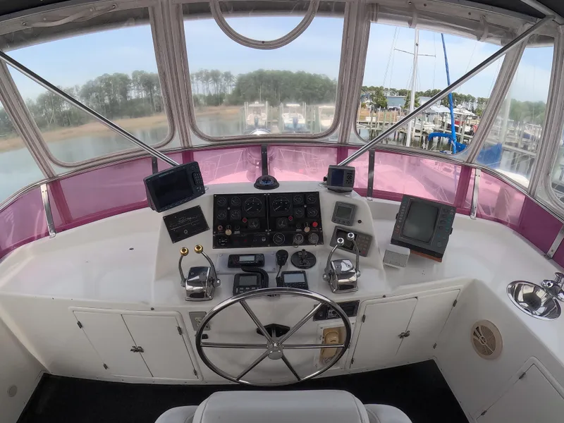 Slide: The Image of Cockpit of 1995 Jefferson 48 Rivanna yacht with steering wheel and navigation instruments. - 8