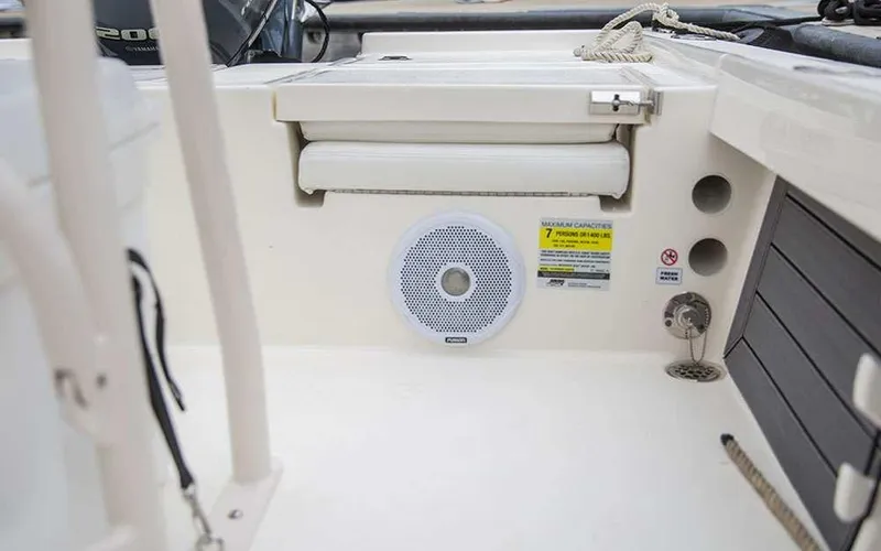 Slide: The Image of 2025 Pathfinder 2200 TRS boat interior with speaker and storage compartments. - 11
