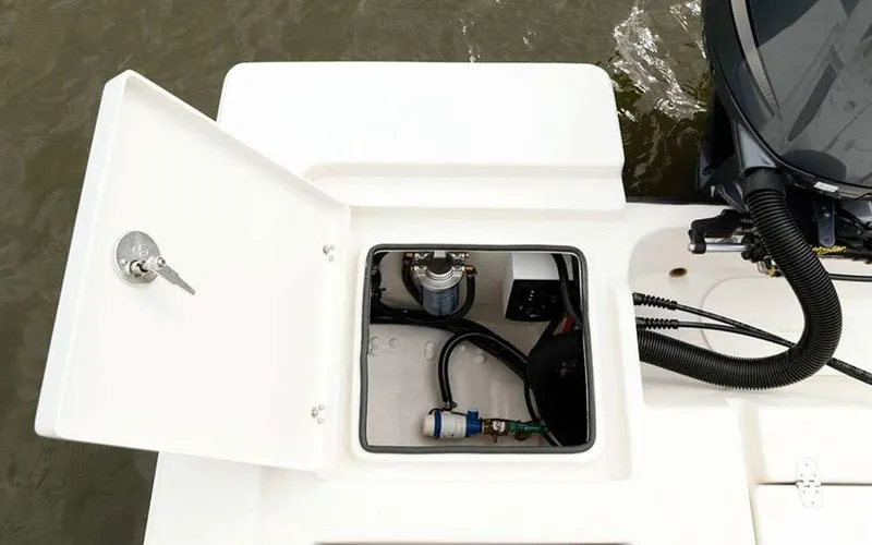 Slide: The Image of Open hatch on 2025 Pathfinder 2200 TRS boat showing internal components. - 13