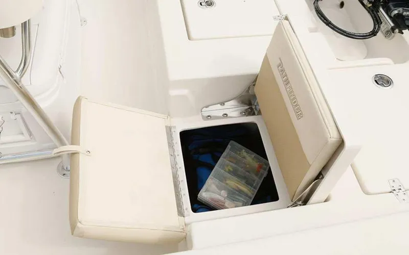 Slide: The Image of 2025 Pathfinder 2200 TRS boat storage compartment with fishing tackle box. - 14