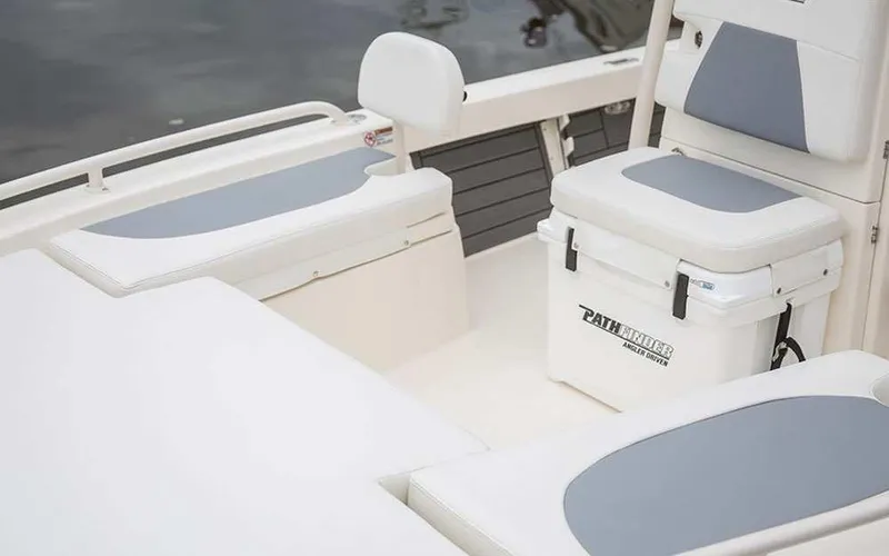 Slide: The Image of 2025 Pathfinder 2200 TRS boat interior with cushioned seating and storage. - 5