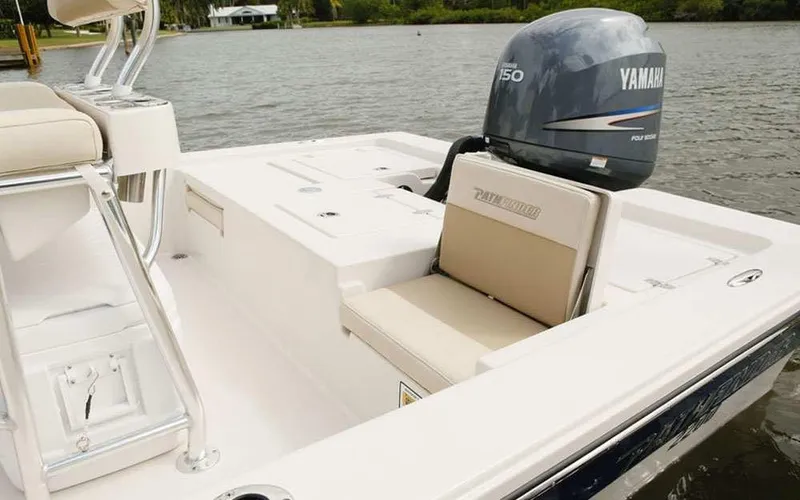 Slide: The Image of 2025 Pathfinder 2200 TRS boat with Yamaha engine on a calm lake. - 8