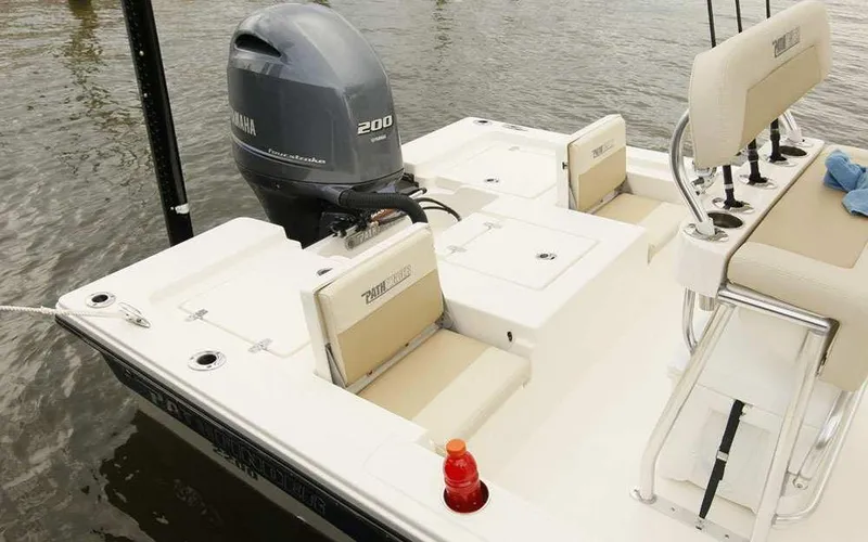 Slide: The Image of 2025 Pathfinder 2200 TRS boat with Yamaha 200 engine, docked on water. - 9