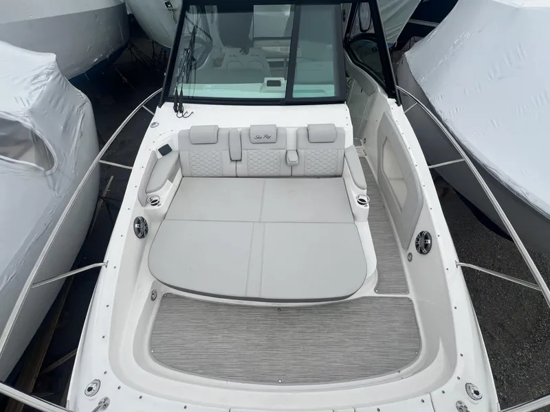 Slide: The Image of 2023 Sea Ray Sundancer 320 boat with spacious seating and sleek design. - 10