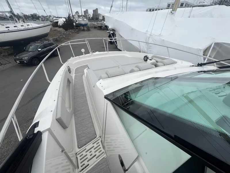 Slide: The Image of 2023 Sea Ray Sundancer 320 yacht with spacious deck and sleek design. - 11