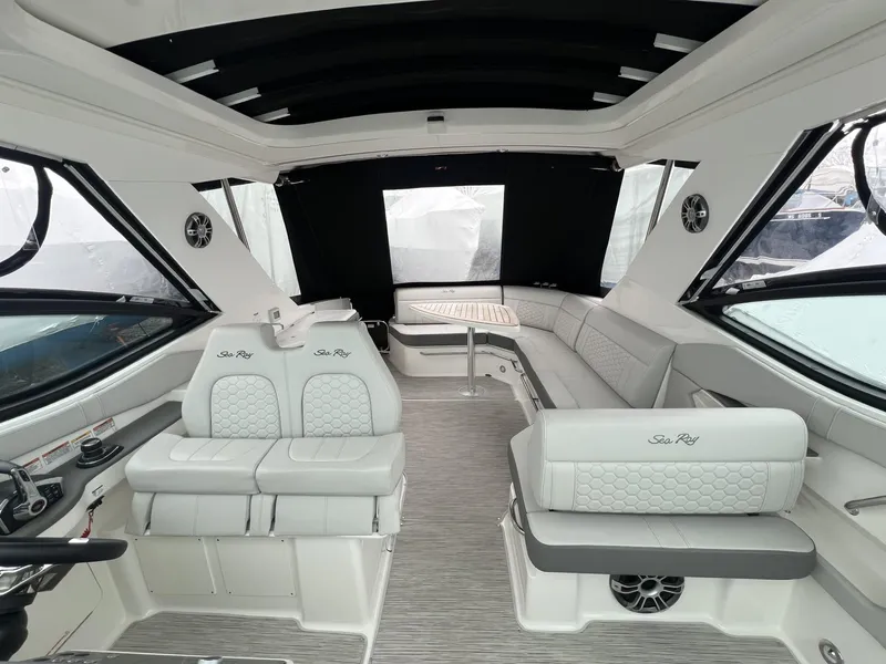 Slide: The Image of 2023 Sea Ray Sundancer 320 interior with luxurious seating and modern design. - 13
