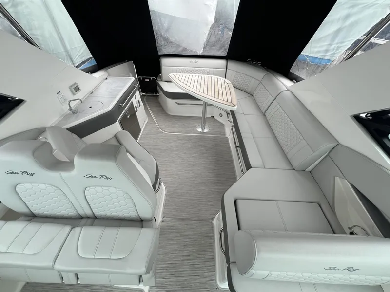 Slide: The Image of Luxurious interior of 2023 Sea Ray Sundancer 320 yacht with elegant seating and table. - 14